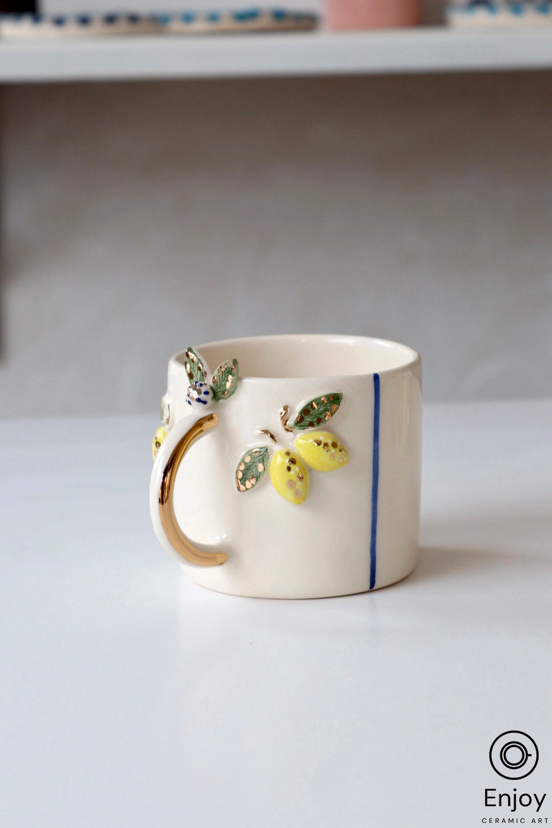 http://enjoyceramicart.com/cdn/shop/files/Lemonmug.webp?v=1686553691