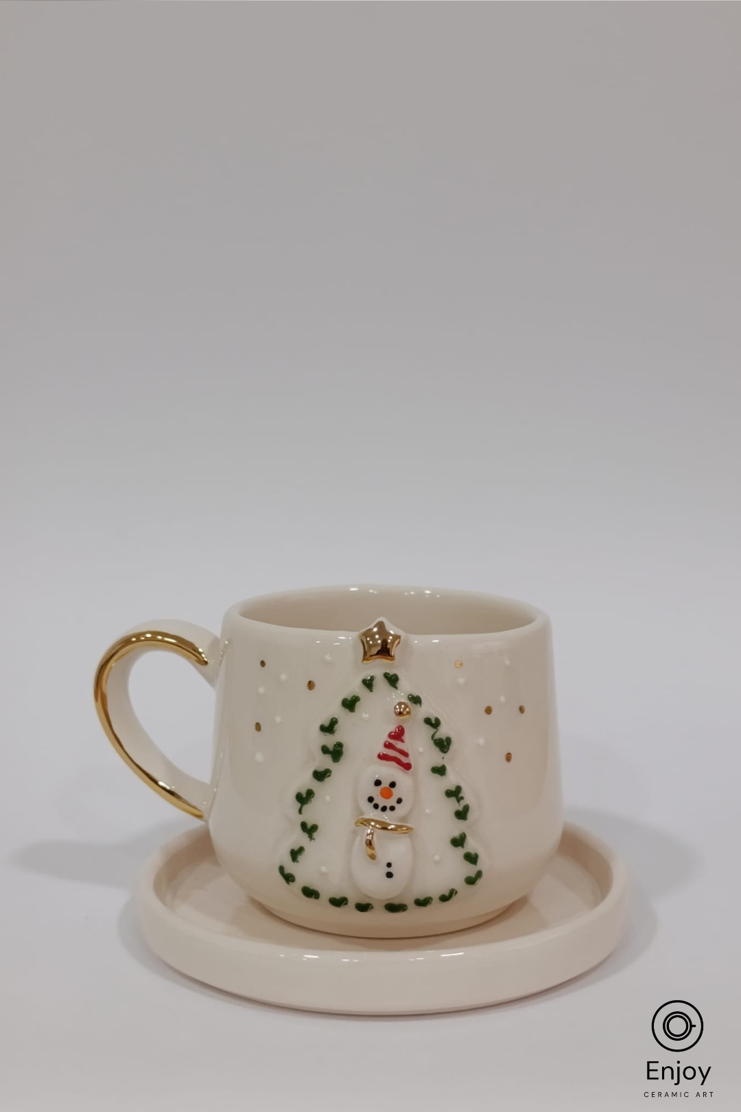 Ceramic mug with snowman design on a white background