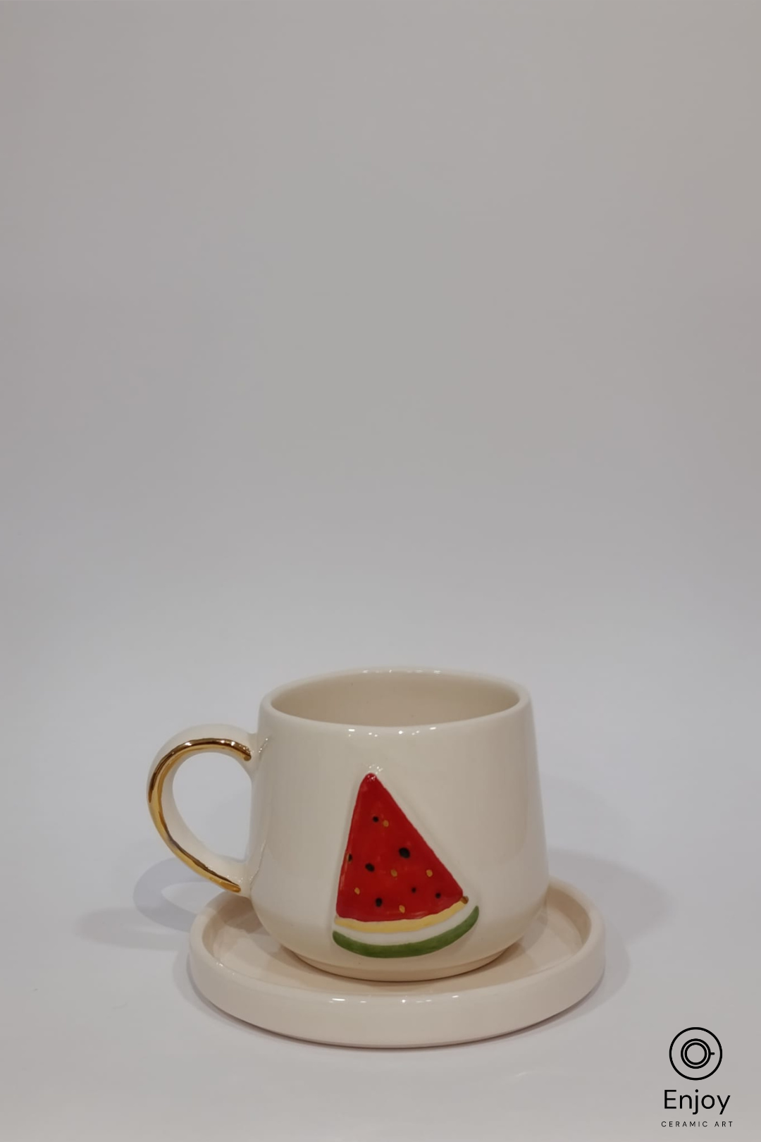 Ceramic mug with watermelon design on a white background