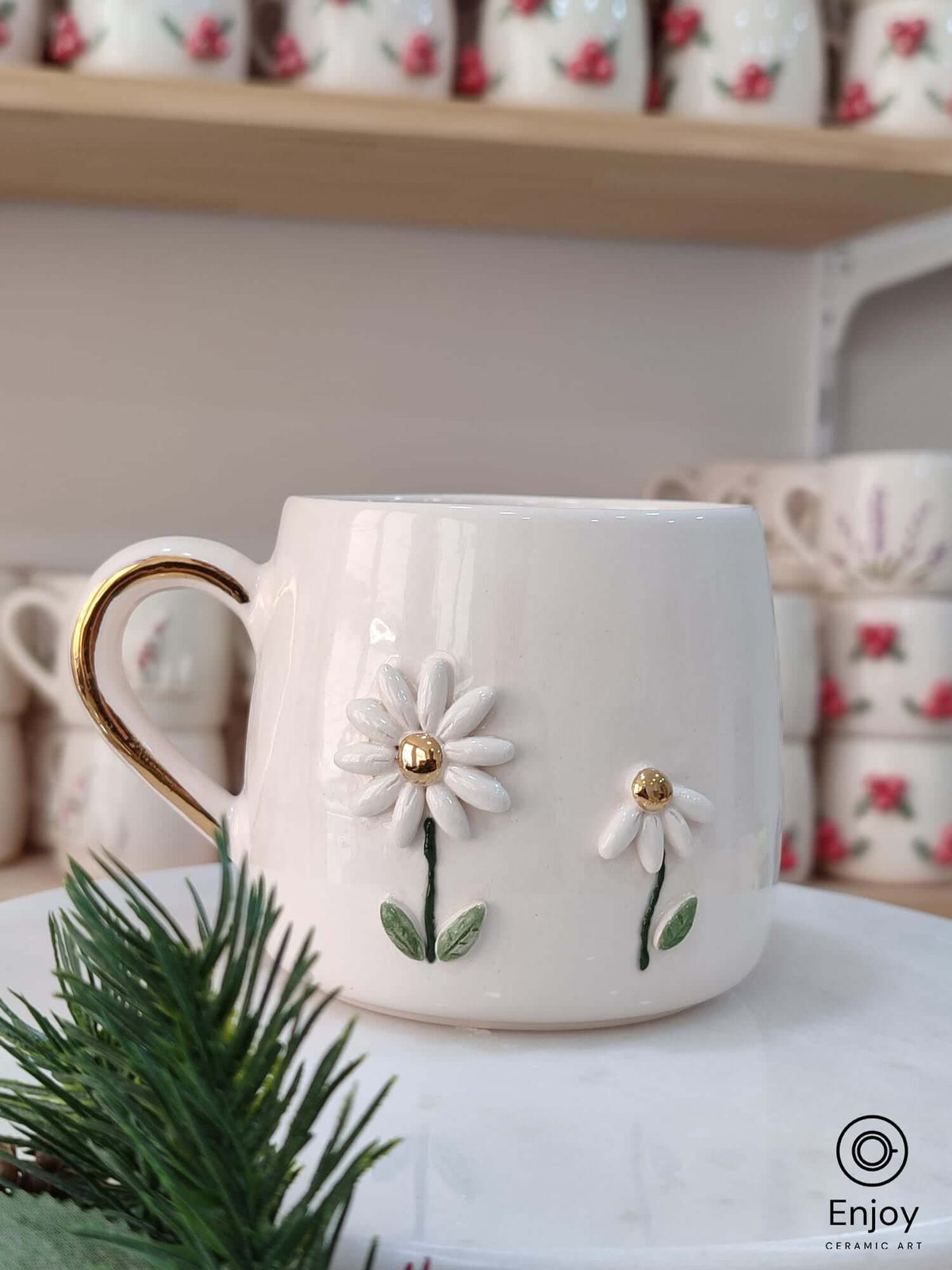 Handmade ceramic mug featuring two delicate daisies with golden centers ...