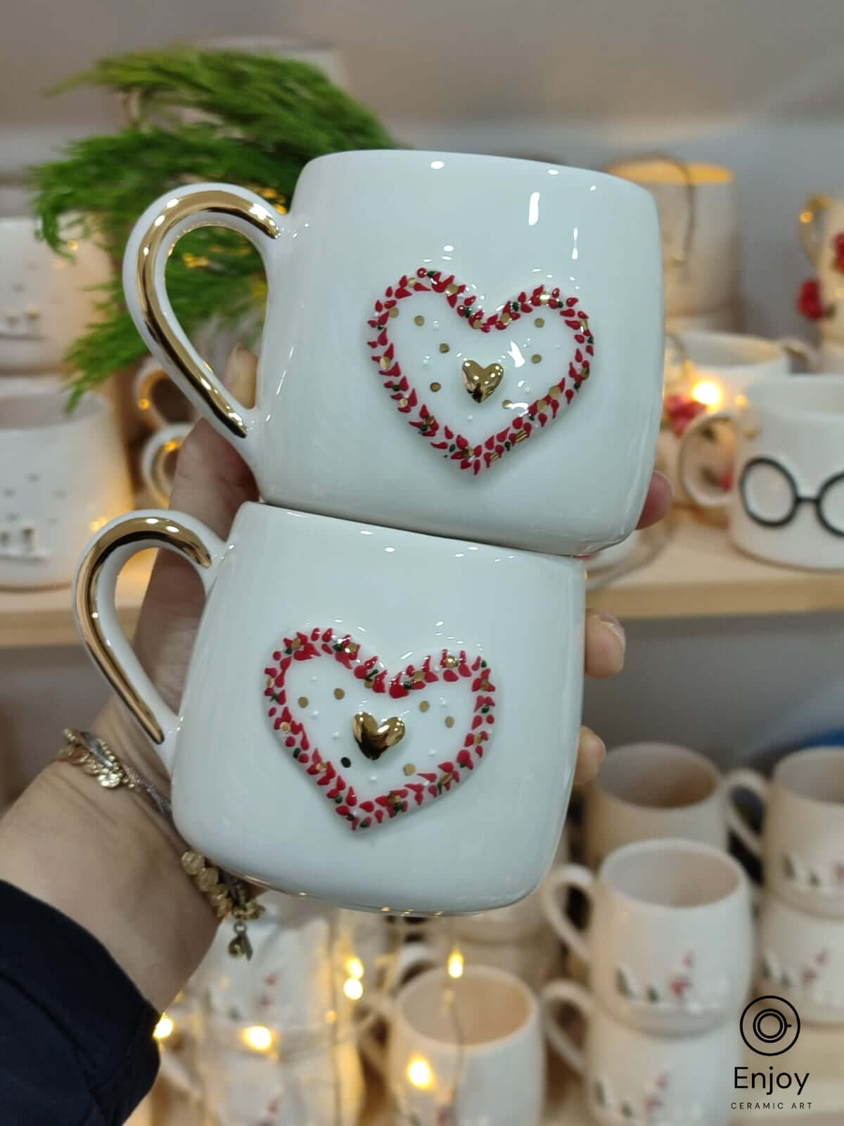 These lovely handmade ceramic mugs with a heart design and golden details are perfect for adding warmth and charm to any moment!