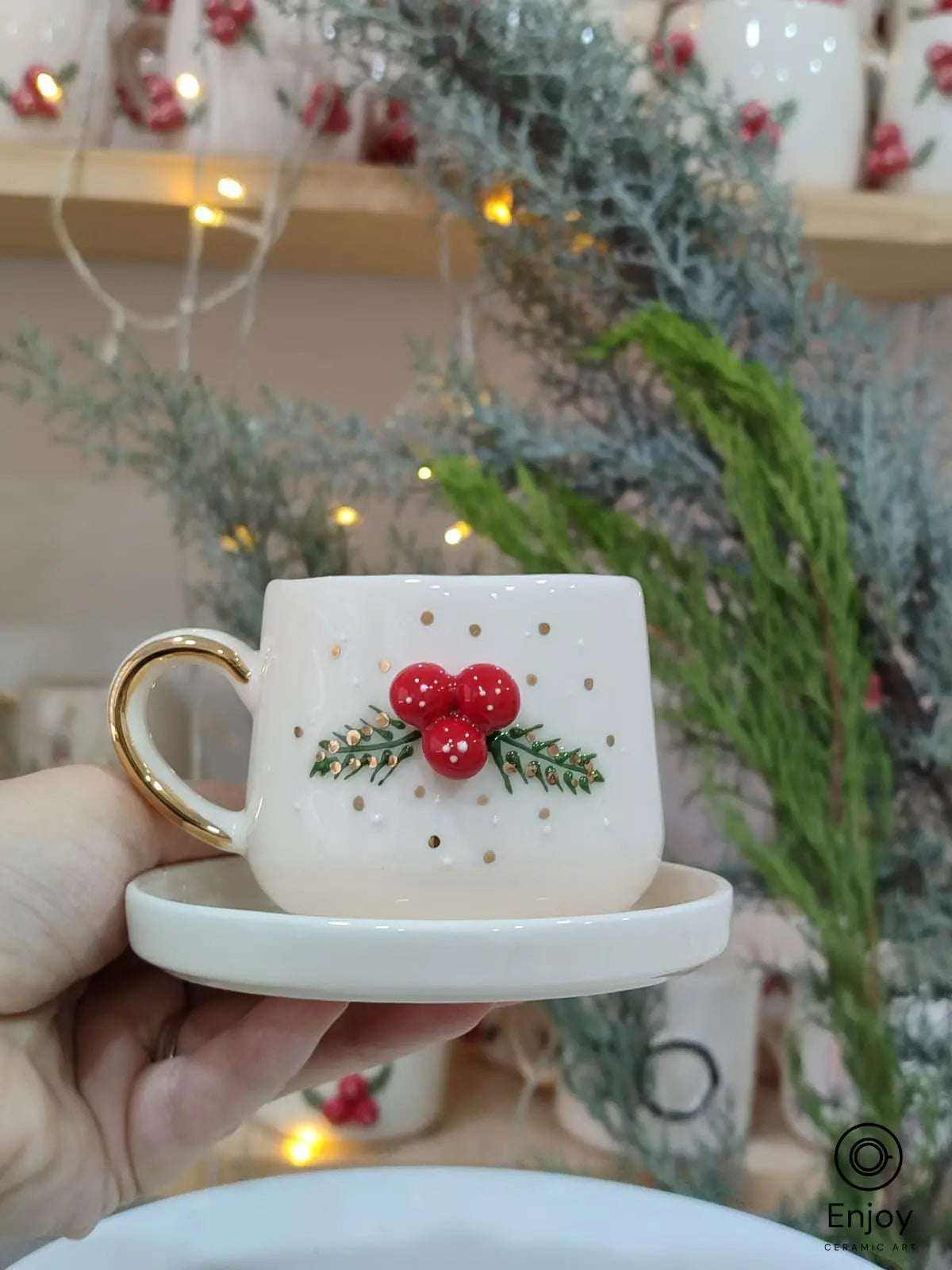 Celebrate the holidays with this handmade Christmas espresso cup! Featuring holly berries, gold details, and a matching saucer – perfect for festive coffee lovers.