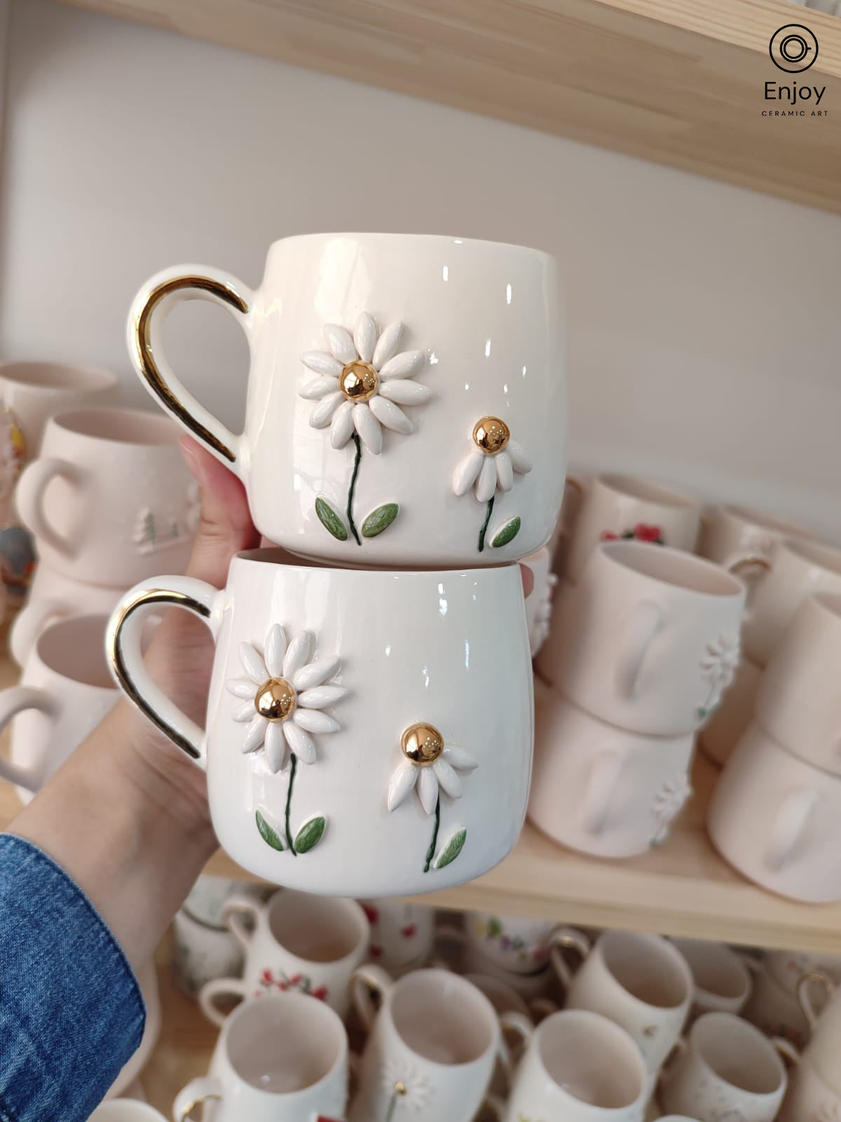 Handmade daisy mug with gold handle and gold center